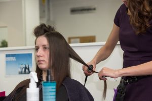 Women practicing beauty techniques inside priosn